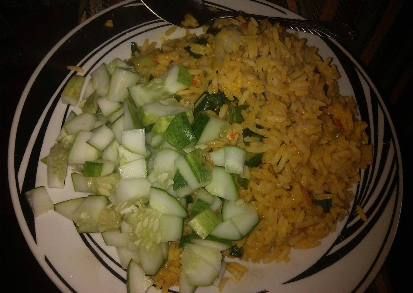Jollof rice garnish with cucumber