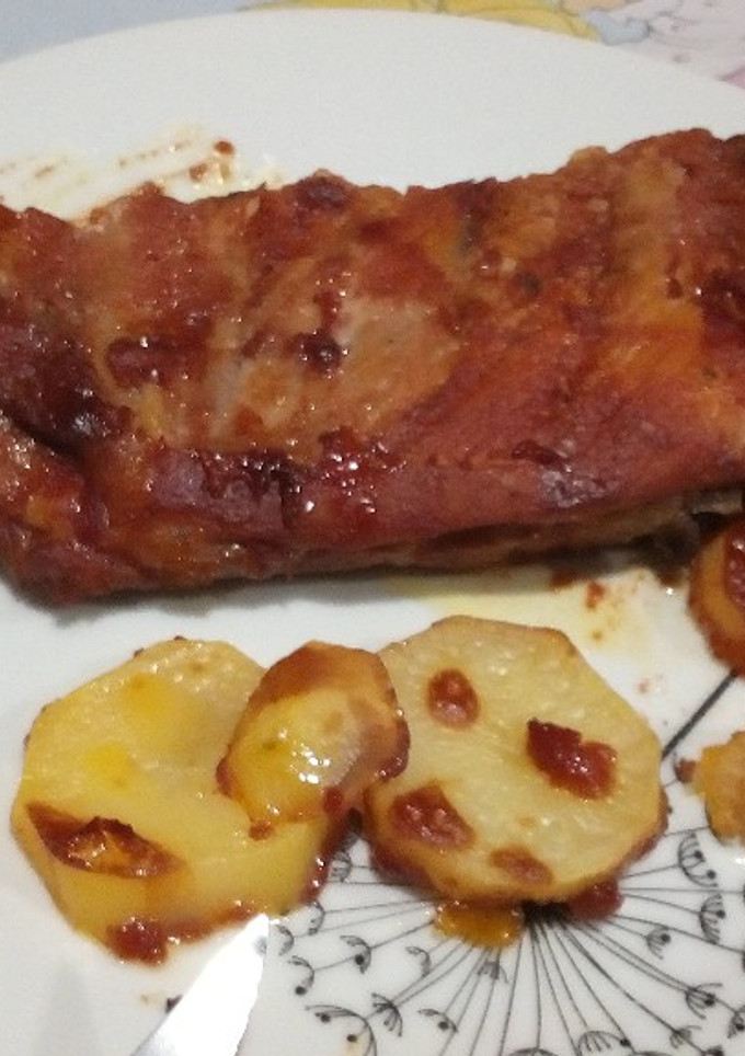 Una foto de Costillar con salsa casera
