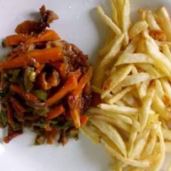 A picture of Fried yam with carrots sauce.