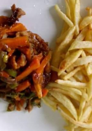 A picture of Fried yam with carrots sauce.