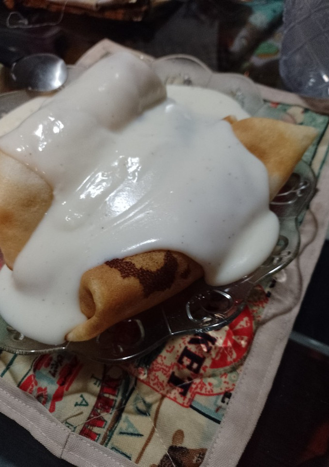 Una foto de Canelones con salsa blanca