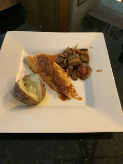 A picture of Bronzino with Spicy Orange Sauce.