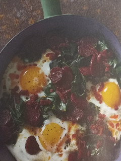 A picture of Kale with Chorizo and Eggs.