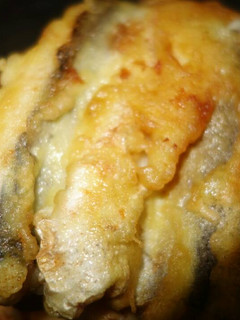 A picture of Fried fish with a beer.