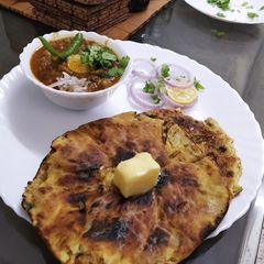 A picture of Amritsari Chole with Amritsari Kulcha.