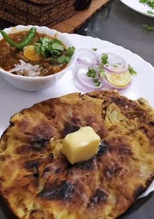 A picture of Amritsari Chole with Amritsari Kulcha.