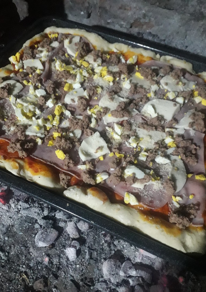 Una foto de Pizza casera a la parrilla