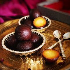 A picture of Gulab jamun with kaju cream filling.