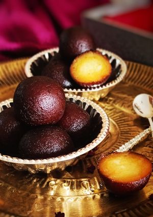 A picture of Gulab jamun with kaju cream filling.