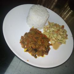A picture of Rice,dry fish,local cucumber.