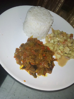 A picture of Rice,dry fish,local cucumber.