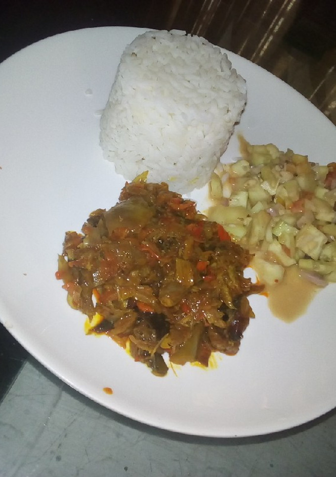 A picture of Rice,dry fish,local cucumber.