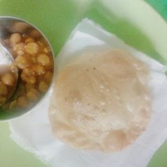 Chana with white puri A picture of Chana with white puri.