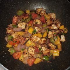 A picture of Sauteed chicken with veggies.