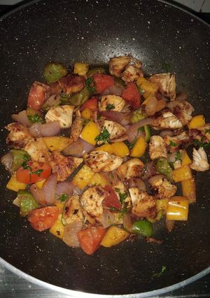 A picture of Sauteed chicken with veggies.
