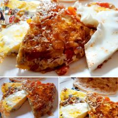 A picture of Egg pizza loaded with veggies.