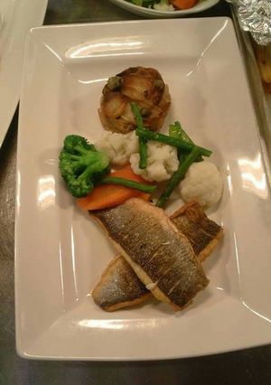 A picture of Pan fried sea bass with seasonal vegetables potote Boulanger's.