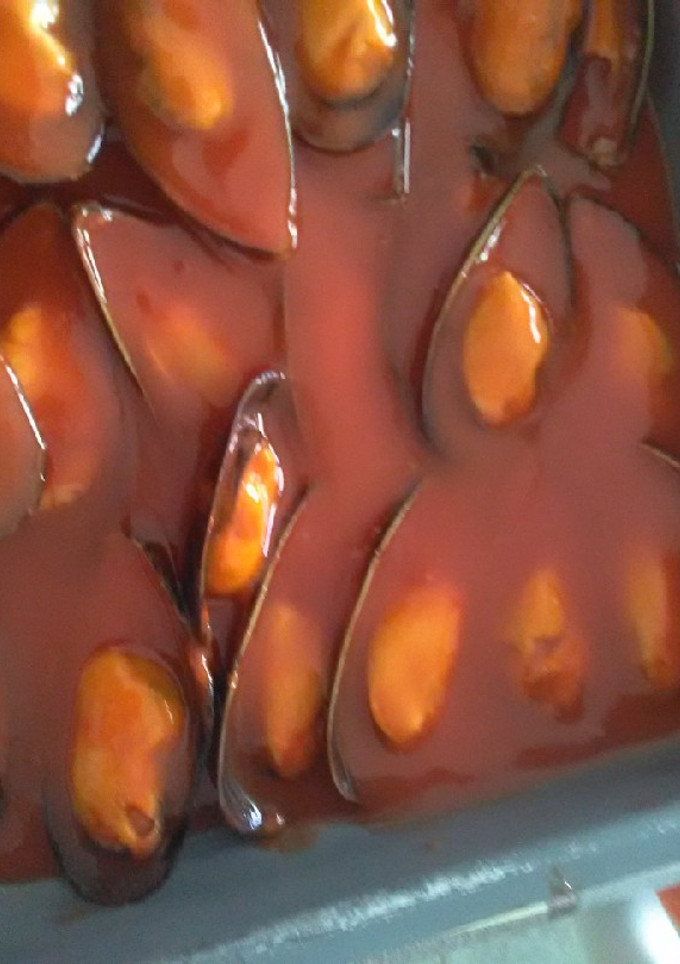 Una foto de Mejillones con tomate