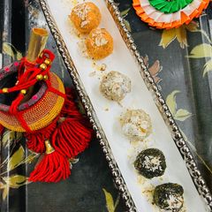 A picture of Tricolour coconut, mango, green peas Sweet Laddu.