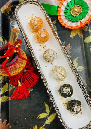 A picture of Tricolour coconut, mango, green peas Sweet Laddu.