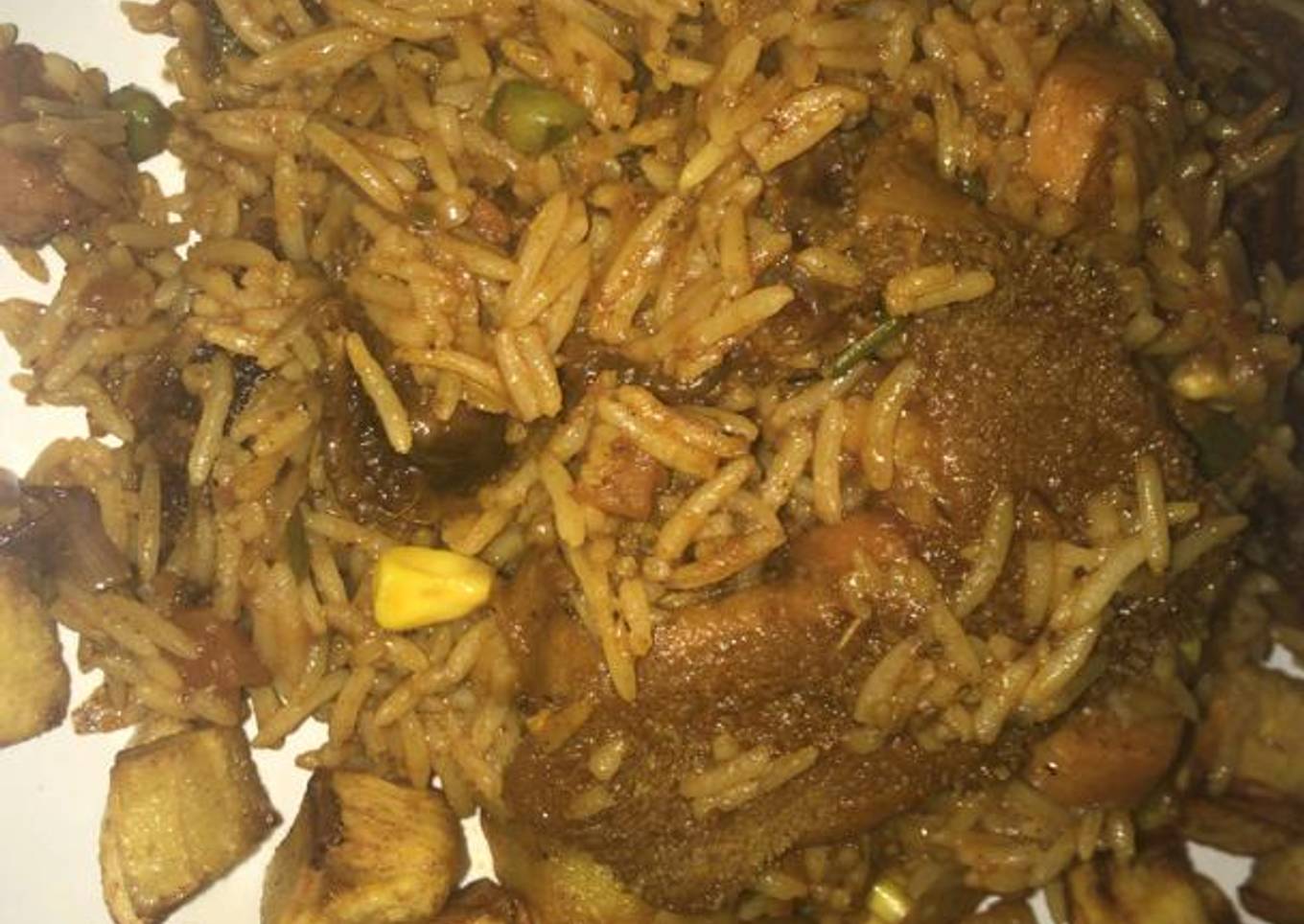 Smoked goat meat jollof with mixed veggies,plus diced dodo