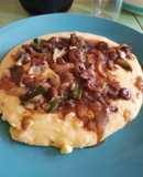 Salteado con corazón de pollo a acompañado polenta
