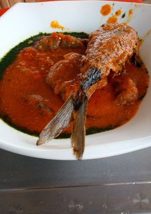 A picture of Ewedu with stew and fish.