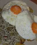 Huevos rotos con patatas y gulas del norte
