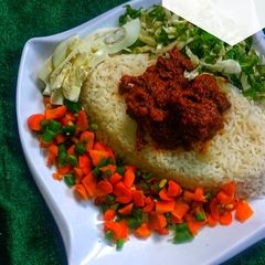 A picture of White rice with stew.