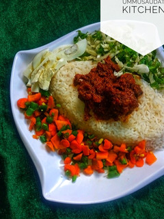 A picture of White rice with stew.