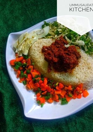A picture of White rice with stew.