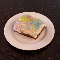 A picture of Fudge Brownies with White Chocolate Truffle Cream.