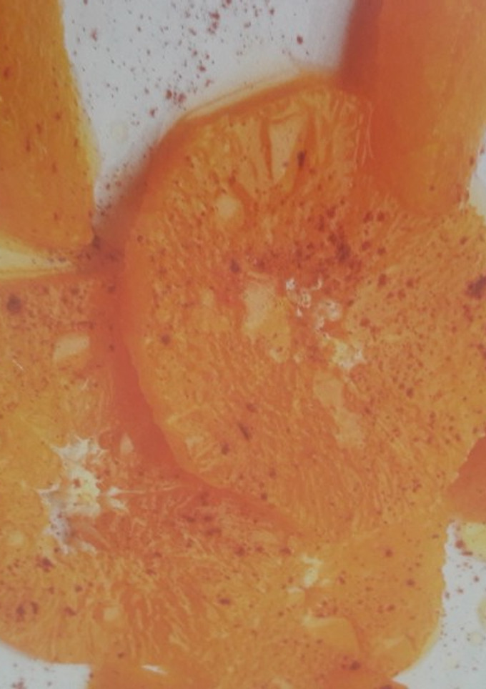 Una foto de Naranjas con aceite