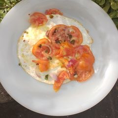 Fried Egg Garnished with Fresh Vegetables A picture of Fried Egg Garnished with Fresh Vegetables.