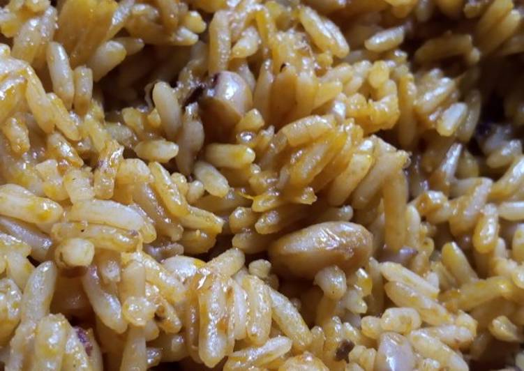 Simple Palm oil jollof rice and beans with locust beans