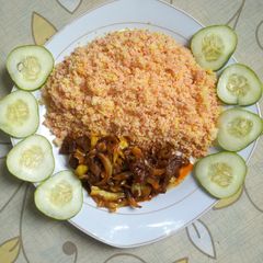 A picture of Couscous with pomo sauce.