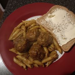 A picture of Turkey Thai curry meatballs with pasta.