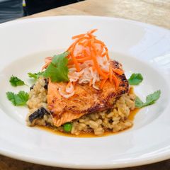 A picture of Bahn-Mi Glazed Salmon with Pho Broth Risotto.