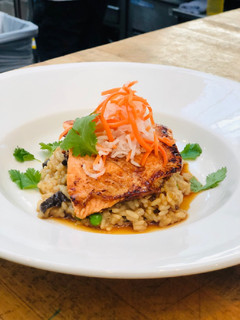 A picture of Bahn-Mi Glazed Salmon with Pho Broth Risotto.