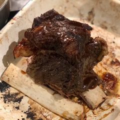 Slow cooked beef rib with a shallot and lemonade dripping A picture of Slow cooked beef rib with a shallot and lemonade dripping.