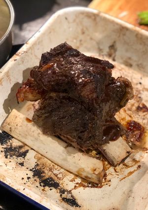 A picture of Slow cooked beef rib with a shallot and lemonade dripping.