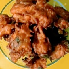 A picture of Chickpea Flour Sweet Corn And Onion Pakora.