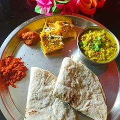 A picture of Jowar bhakri with vegetable zunka wadi.