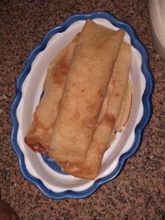 A picture of Plantain pancake filled with scotch egg.