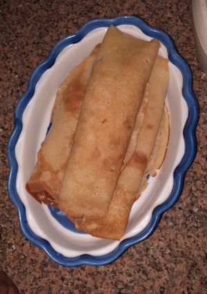 A picture of Plantain pancake filled with scotch egg.
