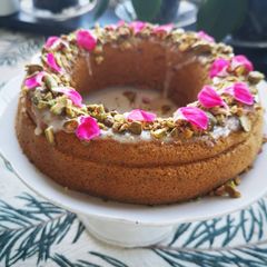 A picture of Carrot cake topping with almond cream and pistachio.