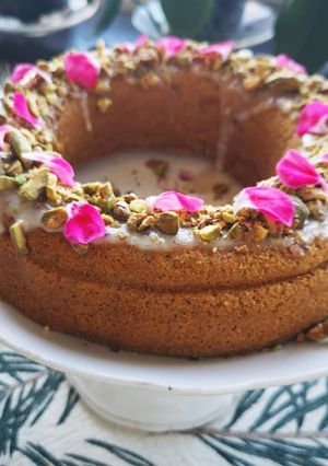 A picture of Carrot cake topping with almond cream and pistachio.