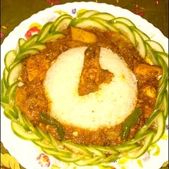 A picture of Chicken tindy korma with wite rice 😋.