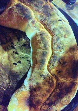 Una foto de 🍕🌎¡Exquisita pizza arrollada a las brasas🇮🇹🌍