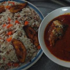 A picture of Rice,beans, plantain and fish stew.